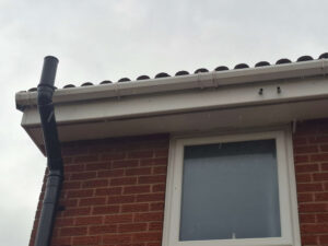 View of upper gutter after cleaning.