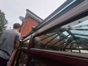 Team working on matching gutter on conservatory roof.