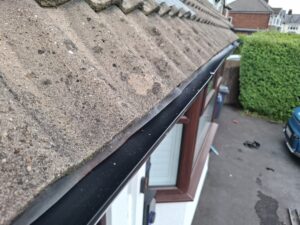 Wide angled view looking down freshly installed gutter on house in Penwortham.