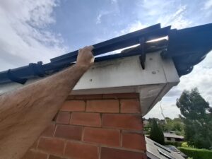 Replacing black gutter against white fascia on property in Fulwood Preston.