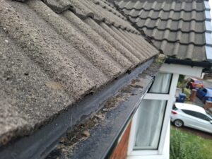 Top floor guttering half cleaned at Penwortham property.