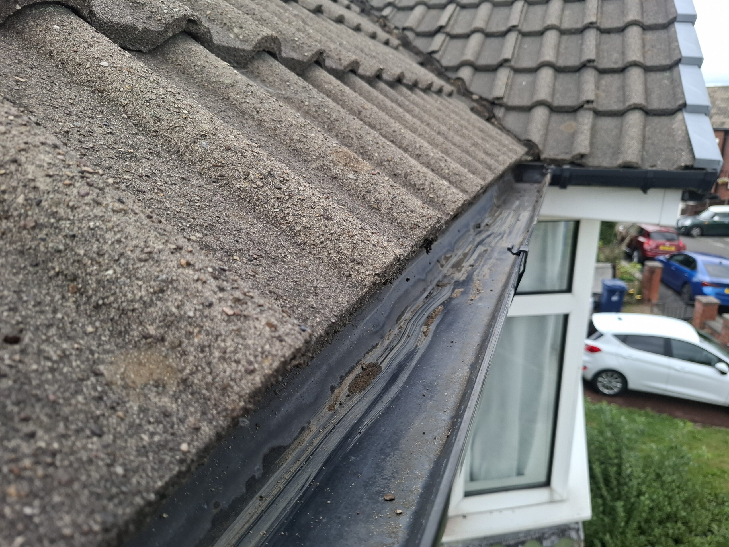 Close up of top floor guttering after being completely cleaned and drained.