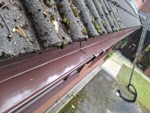 Wide angle view of gutter after leaves removed and un-clogged.