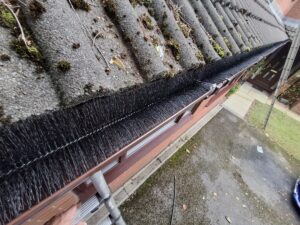 Full view of Fulwood guttering with gutter guard installed with plastic clips.