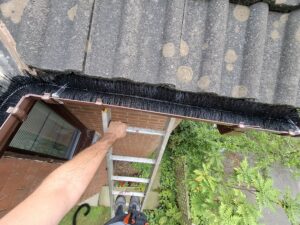 Top view of corner guttering with gutter guard installed and fixed securely in place.